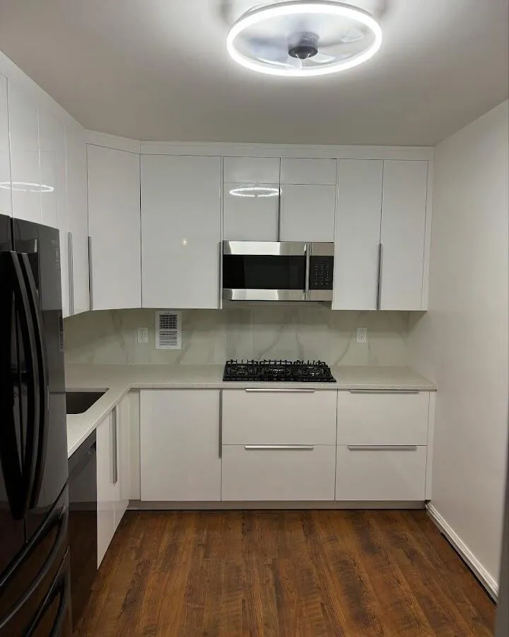 Renovated kitchen with quartz countertops in Bedford